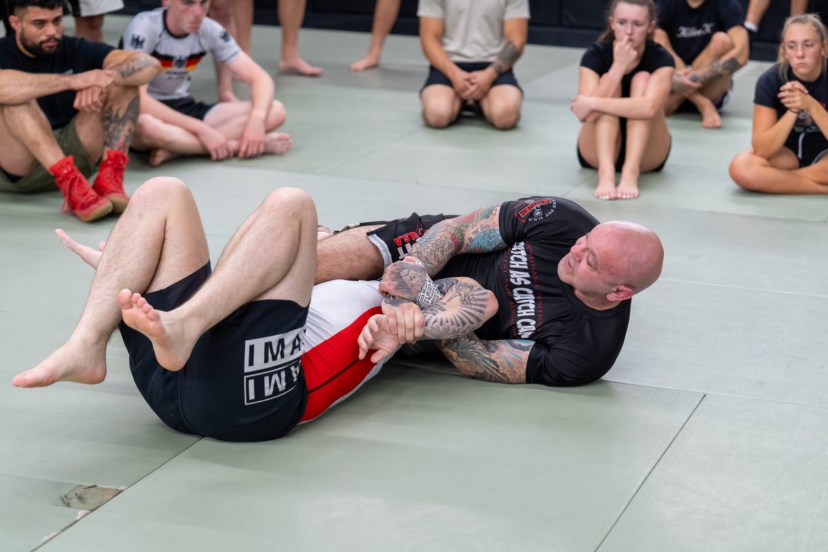 Coach demonstrating guard work to the class
