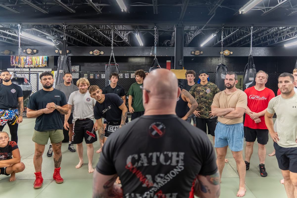 Adult class gathered on the mats