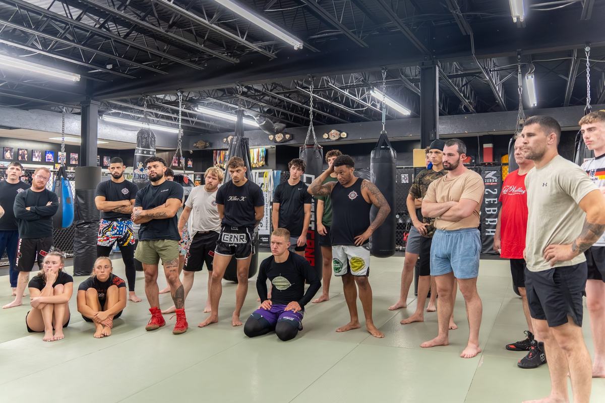 A packed adult class on the mats at Tactical Combat Academy
